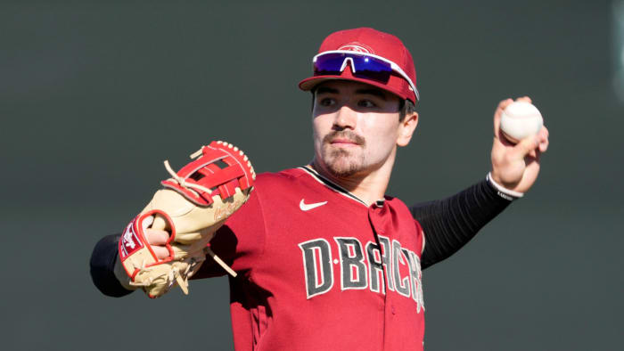 Feb 21, 2022; Scottsdale, Ariz., U.S.; Diamondbacks minor league outfielder Corbin Carroll throws during a select training camp for minor-league players not covered by the Players Association at Salt River Fields. MLB continues to be in a lockout after the expiration of the collective bargaining agreement Dec. 2.